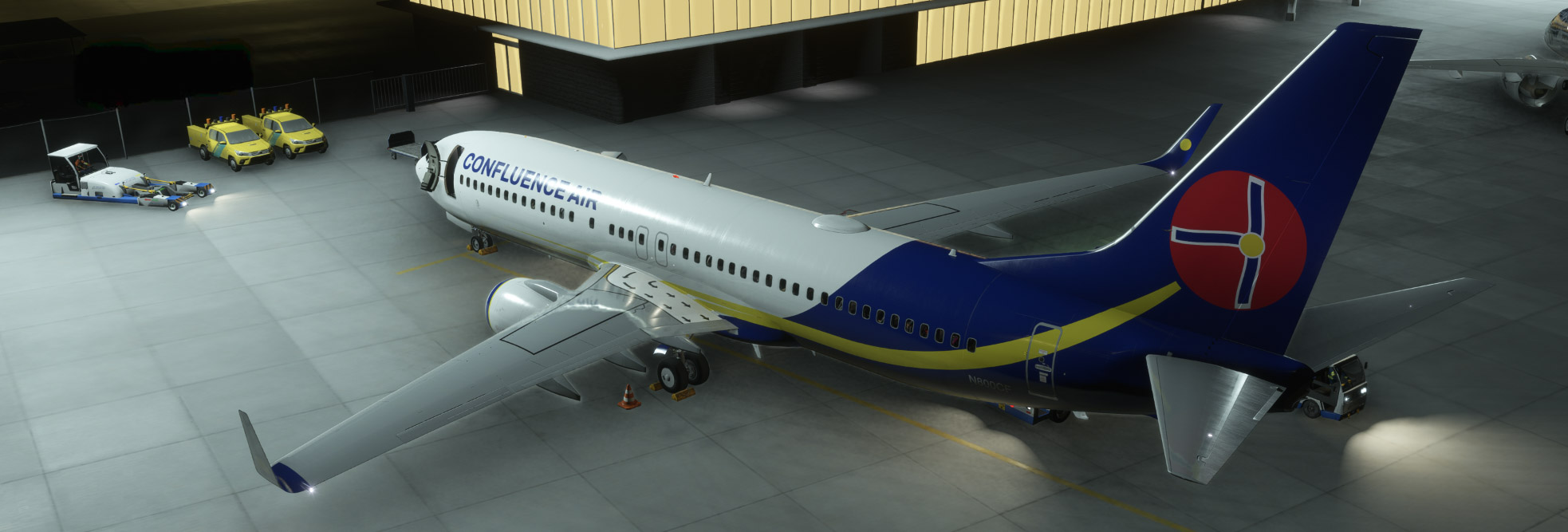 Confluence Air Boeing 737-800 N800CF parked on the ramp at Spirit of St. Louis Airport at night, with ground equipment positioned around the aircraft